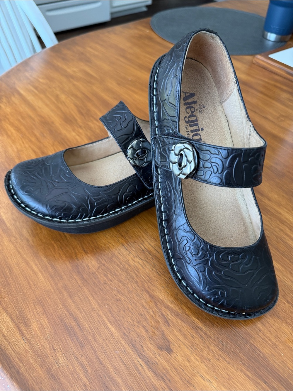 Alegria Black Embossed Mary Jane Flats with Floral Button